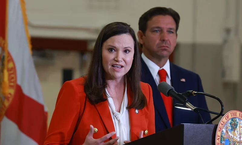 WEST PALM BEACH, FLORIDA - SEPTEMBER 17: Florida Gov. Ron DeSantis listens as Florida Attorney General Ashley Moody speaks during a press conference regarding an apparent assassination attempt of former President Donald Trump on September 17, 2024 in West Palm Beach, Florida. The Governor announced that the State of Florida's law enforcement will do their own investigation into the incident, which the FBI said "appears to be an attempted assassination of former President Trump' while he was golfing at Trump International Golf Club. (Photo by Joe Raedle/Getty Images)