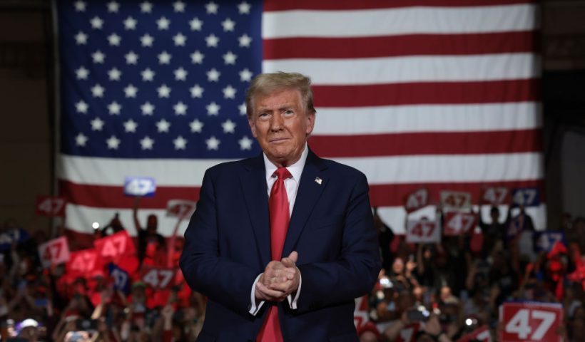 LANCASTER, PENNSYLVANIA - OCTOBER 20: Republican presidential nominee, former U.S. President Donald Trump, arrives on stage during a town hall campaign event at the Lancaster County Convention Center on October 20, 2024 in Lancaster, Pennsylvania. Trump is campaigning the entire day in the state of Pennsylvania. Trump and Democratic presidential nominee Vice President Kamala Harris continue to campaign in battleground swing states ahead of the November 5 election. (Photo by Win McNamee/Getty Images)