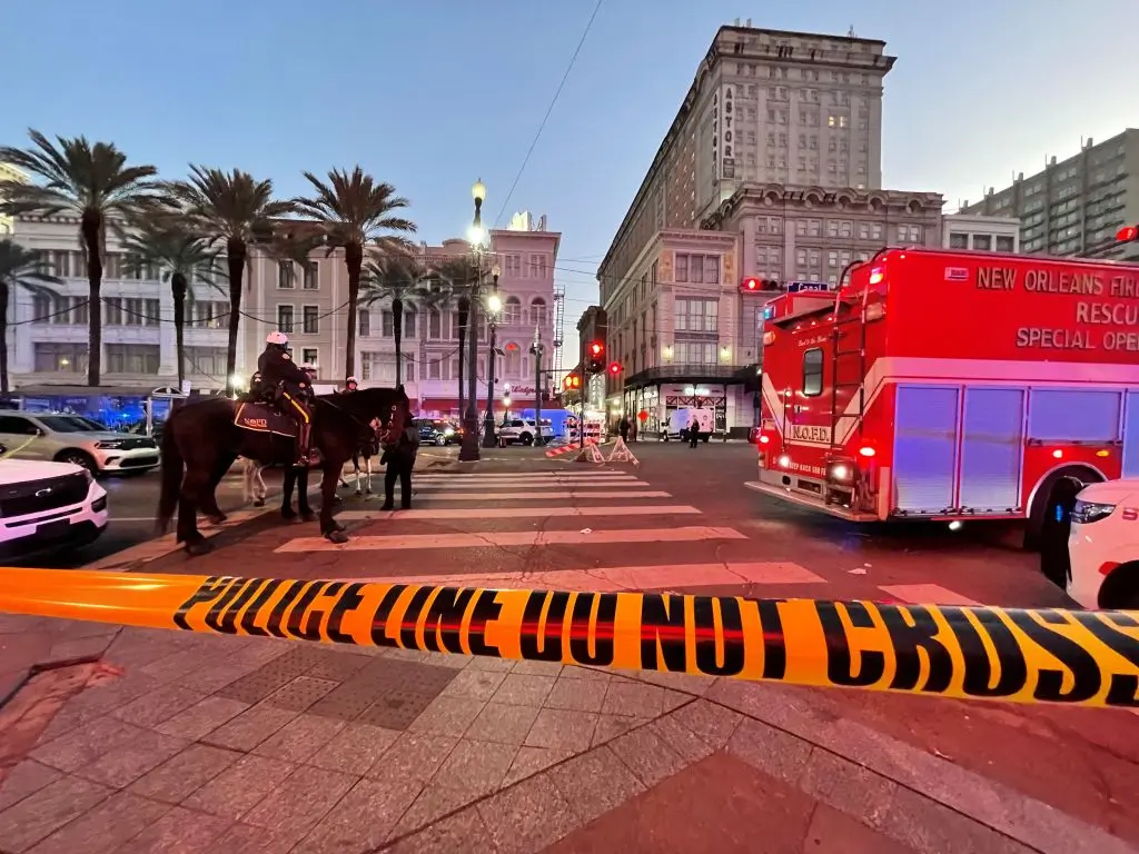 Police cordon off the intersection of Canal Street and Bourbon Street in the French Quarter of New Orleans, Louisiana, on January 1, 2025. At least 10 people were killed and 30 injured Wednesday when a vehicle plowed overnight into a New year's crowd in the heart of the thriving New Orleans tourist district, authorities in the southern US city said. (Photo by Matthew HINTON / AFP) (Photo by MATTHEW HINTON/AFP via Getty Images)