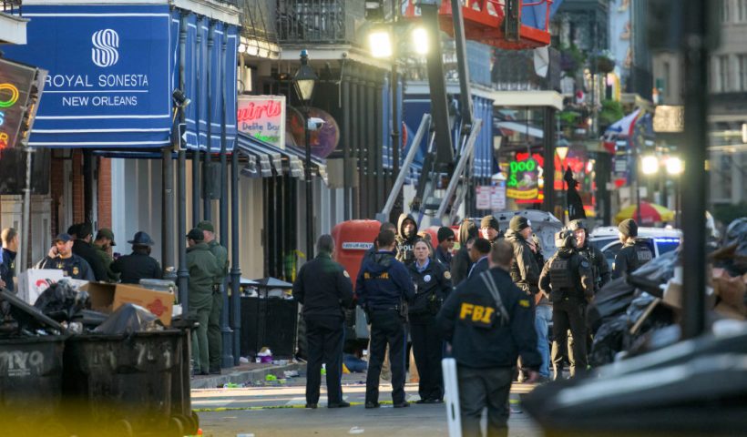 FBI investigators arrive at the scene where the white Ford F-150 pickup truck that crashed into a work lift after allegedly driving into a crowd of New Year's revelers in the French Quarter of New Orleans, Louisiana, on January 1, 2025. At least 10 people were killed and 30 injured Wednesday when a vehicle plowed overnight into a New year's crowd in the heart of the thriving New Orleans tourist district, authorities in the southern US city said. (Photo by Matthew HINTON / AFP) (Photo by MATTHEW HINTON/AFP via Getty Images)