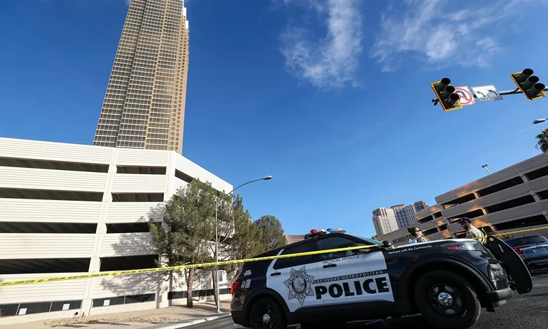 Police block an area where a Tesla Cybertruck caught fire and exploded outside the lobby of President-elect Donald Trump's hotel, on January 1, 2025, in Las Vegas. At least one person was killed and seven wounded when a Tesla Cybertruck exploded outside a hotel belonging to US President-elect Donald Trump in Las Vegas, police said Wednesday. (Photo by WADE VANDERVORT / AFP) (Photo by WADE VANDERVORT/AFP via Getty Images)