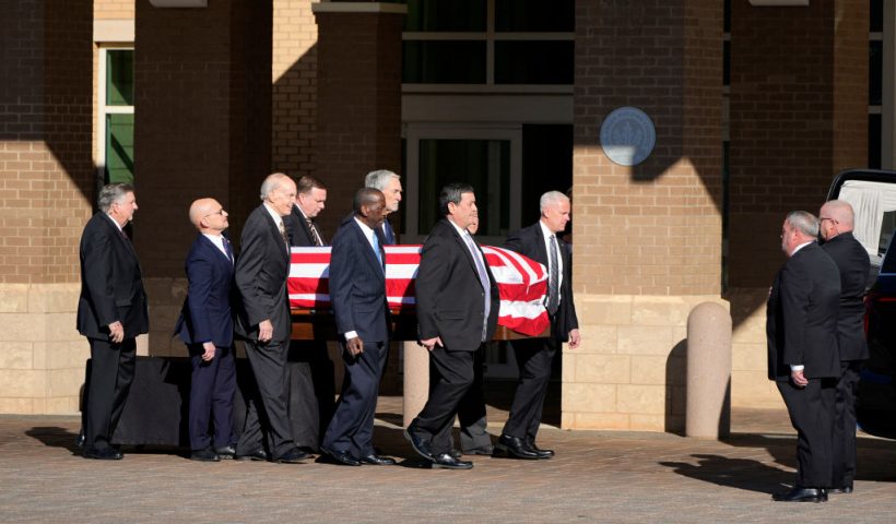 Former and current US Secret Service agents assigned to the Carter detail, move the flag-draped casket of former US President Jimmy Carter, at Phoebe Sumter Medical Center in Americus, Georgia, on January 4, 2025. Carter, the 39th President of the United States, died at the age of 100 on December 29, 2024 at his home in Plains, Georgia. (Photo by Alex Brandon / POOL / AFP) (Photo by ALEX BRANDON/POOL/AFP via Getty Images)