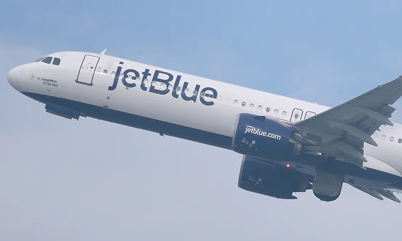 LOS ANGELES, CALIFORNIA - JANUARY 03: A JetBlue plane takes off from Los Angeles International Airport (LAX) on January 03, 2025 in Los Angeles, California. JetBlue has been fined $2 million by the Department of Transportation for ‘operating multiple chronically delayed flights’ which marks the first time an airline has received such a penalty. (Photo by Mario Tama/Getty Images)