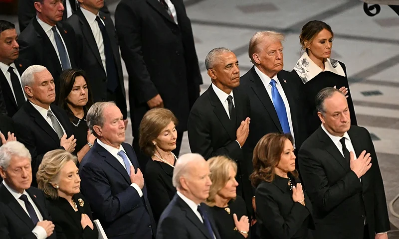 From L to R, first row, US President Joe Biden, First Lady Jill Biden, Vice President Kamala Harris, Second Gentleman Doug Emhoff, second row, former President Bill Clinton, former Secretary of State Hillary Clinton, former President George W. Bush, his wife Laura Bush, former President Barack Obama, President-elect Donald Trump and his wife Melania Trump attend the State Funeral Service for former US President Jimmy Carter at the Washington National Cathedral in Washington, DC, on January 9, 2025. (Photo by Mandel NGAN / AFP) (Photo by MANDEL NGAN/AFP via Getty Images)