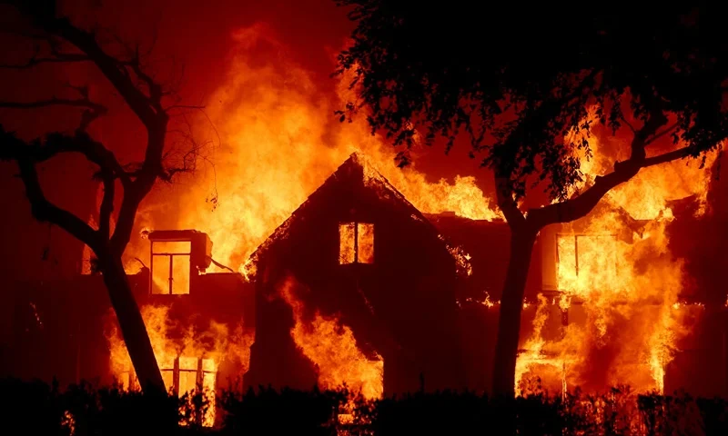 ALTADENA, CALIFORNIA - JANUARY 08: Fire engulfs a home as the Eaton Fire moves through the area on January 08, 2025 in Altadena, California. Fueled by intense Santa Ana Winds, the Palisades Fire has grown to over 2,900 acres and 30,000 people have been ordered to evacuate while a second fire has emerged near Eaton Canyon in Altadena. (Photo by Justin Sullivan/Getty Images)