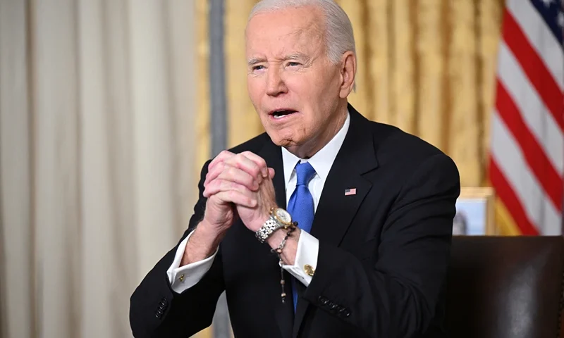 US President Joe Biden clasps his hands as he delivers his farewell address to the nation from the Oval Office of the White House in Washington, DC, on January 15, 2025. (Photo by Mandel NGAN / POOL / AFP) (Photo by MANDEL NGAN/POOL/AFP via Getty Images)