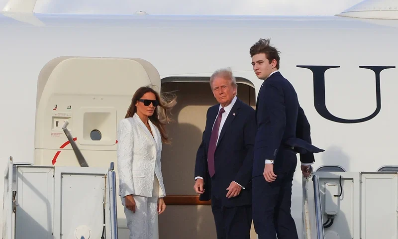 US President-elect Donald Trump, his wife Melania Trump and their son Barron board a US government aircraft at Palm Beach International Airport in West Palm Beach, Florida, on January 18, 2025. Trump is headed to Washington, DC, for his inauguration on January 20. (Photo by Eva Marie UZCATEGUI / AFP) (Photo by EVA MARIE UZCATEGUI/AFP via Getty Images)