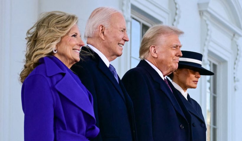 TOPSHOT - US President Joe Biden and First Lady Jill Biden greet President-elect Donald Trump and Melania Trump as they arrive at the White House in Washington, DC, on January 20, 2025, before departing for the US Capitol where Trump will be sworn in as the 47th US President. (Photo by Jim WATSON / AFP) (Photo by JIM WATSON/AFP via Getty Images)