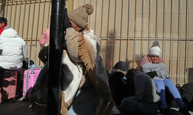 Colombia's Marjelis Tinoco, 48, cries after learning of the cancellation of the CBP One application on the day of her appointment to enter through the Paso del Norte international bridge to El Paso, Texas, United States, from Ciudad Juarez, state of Chihuahua, Mexico, on January 20, 2025. Minutes after his inauguration, US President Donald Trump said that he will issue a raft of executive orders aimed at reshaping citizenship and immigration issues stating that he will declare "a national emergency at our southern border" and that "all illegal entry will immediately be halted". (Photo by HERIKA MARTINEZ / AFP) (Photo by HERIKA MARTINEZ/AFP via Getty Images)