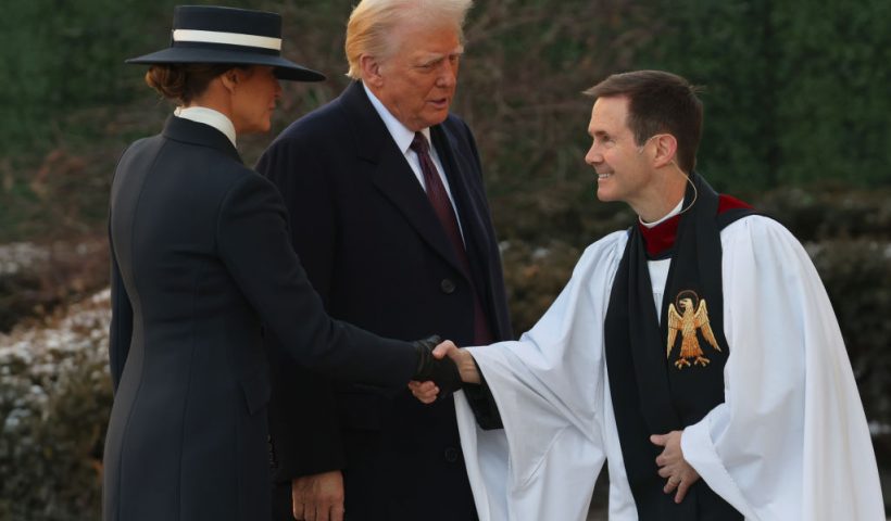 WASHINGTON, DC - JANUARY 20: Melania Trump and U.S. President-elect Donald Trump are greeted by Rev. Robert W. Fisher as they arrive for services at St. John's Church as part of Inauguration ceremonies on January 20, 2025 in Washington, DC. Donald Trump takes office for his second term as the 47th president of the United States. (Photo by Scott Olson/Getty Images)