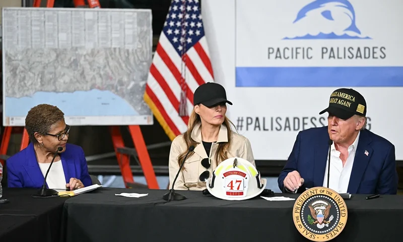Los Angeles Mayor Karen Bass and US First Lady Melania Trump look on as US President Donald Trump speaks during a fire emergency briefing at Station 69 in Pacific Palisades, a neighborhood of Los Angeles, California, on January 24, 2025. (Photo by Mandel NGAN / AFP) (Photo by MANDEL NGAN/AFP via Getty Images)