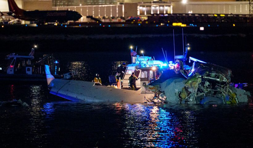 ARLINGTON, VIRGINIA - JANUARY 30: (EDITORS NOTE: Image contains graphic content) Emergency response units assess airplane wreckage in the Potomac River near Ronald Reagan Washington Airport on January 30, 2025 in Arlington, Virginia. An American Airlines flight from Wichita, Kansas collided with a helicopter while approaching Ronald Reagan National Airport. (Photo by Andrew Harnik/Getty Images)