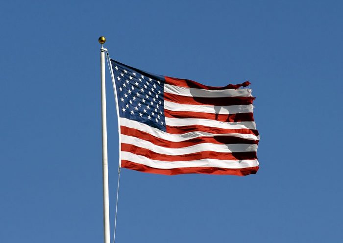 TAMPA, FL - DECEMBER 16: The American Flag flies in a stiff breeze during pre-game ceremonies as the Tampa Bay Buccaneers host the Atlanta Falcons at the Raymond James Stadium on December 16, 2007 in Tampa, Florida. The Bucs won 37 - 3 and clinched a playoff berth. (Photo by Al Messerschmidt/Getty Images) *** Local Caption ***