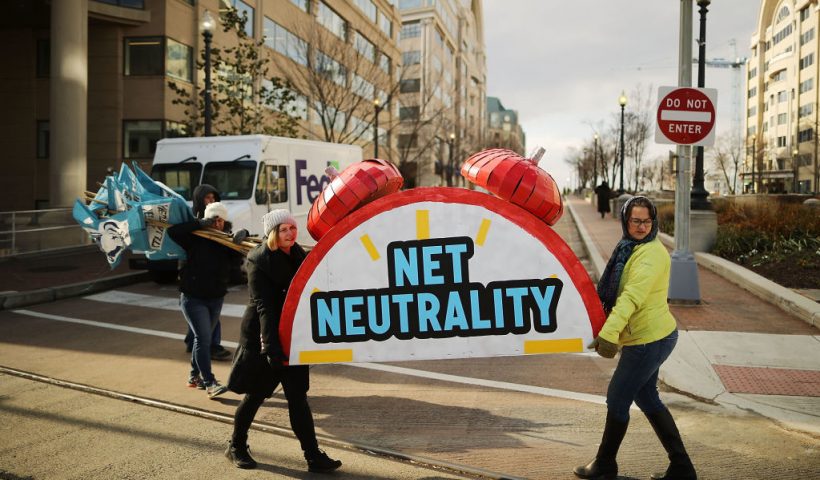 WASHINGTON, DC - DECEMBER 14: Rally organizers carry away props following a protest outside the Federal Communication Commission building against the end of net neutralityrules December 14, 2017 in Washington, DC. Lead by FCC Chairman Ajit Pai, the commission is expected to do away with Obama Administration rules that prevented internet service providers from creating different levels of service and blocking or promoting individual companies and organizations on their systems. (Photo by Chip Somodevilla/Getty Images)