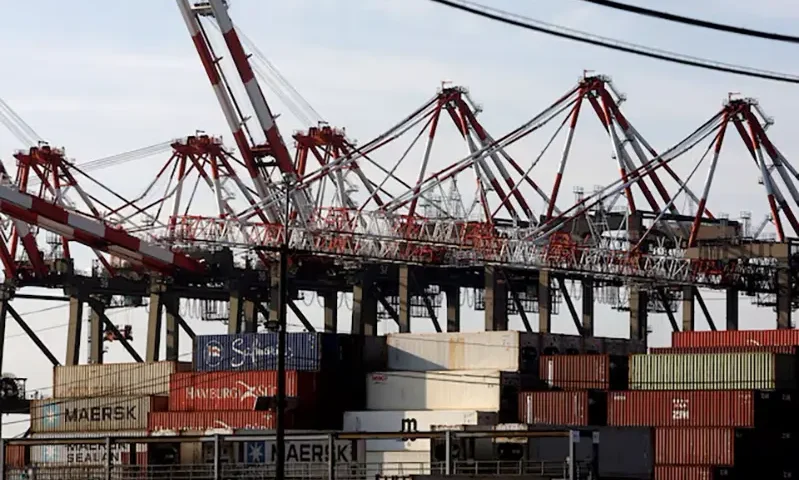 Containers are stacked beneath cranes at Port Newark Container Terminal in Newark, New Jersey, U.S., October 4, 2024. REUTERS/Mike Segar/File Photo