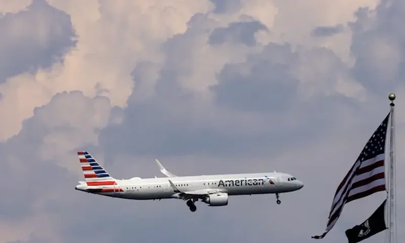 An American Airlines commercial aircraft flies over Washington as it approaches to land at Dulles International Airport, as seen from Washington, U.S., August 5, 2024. REUTERS/ Umit Bektas/File Photo