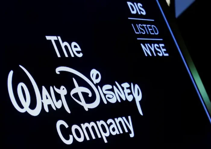 A screen shows the logo and a ticker symbol for The Walt Disney Company on the floor of the New York Stock Exchange (NYSE) in New York, U.S., December 14, 2017. REUTERS/Brendan McDermid/File Photo