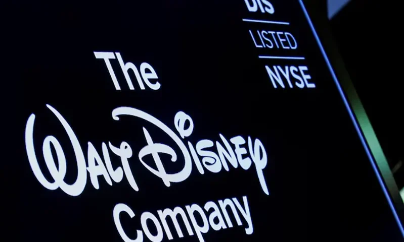 A screen shows the logo and a ticker symbol for The Walt Disney Company on the floor of the New York Stock Exchange (NYSE) in New York, U.S., December 14, 2017. REUTERS/Brendan McDermid/File Photo