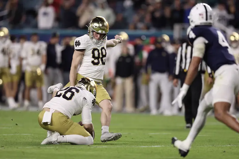 Notre Dame Fighting Irish place kicker Mitch Jeter (98) kicks the ball in the second half against the Penn State Nittany Lions in the Orange Bowl at Hard Rock Stadium. Mandatory Credit: Nathan Ray Seebeck-Imagn Images/ File Photo