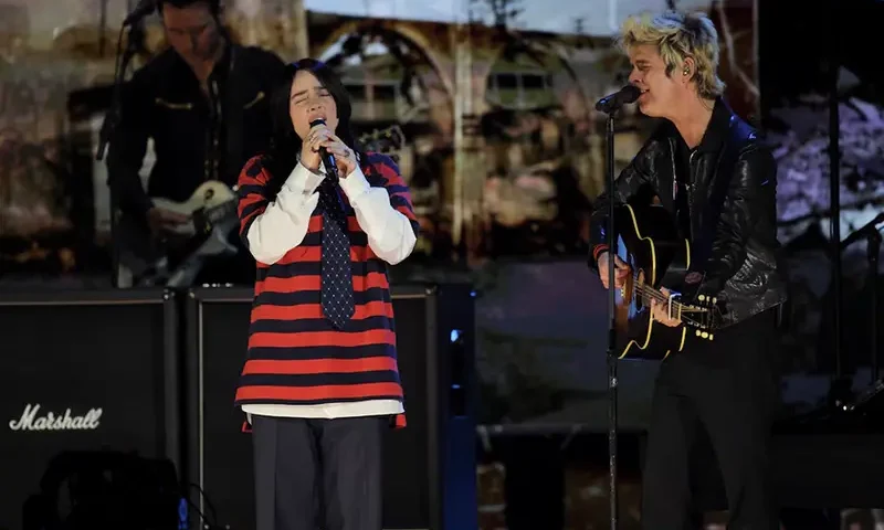 Billie Joe Armstrong of Green Day and Billie Eilish perform during the FireAid benefit concert for Los Angeles wildfire relief efforts, in Inglewood, California, U.S., January 30, 2025. REUTERS/Daniel Cole
