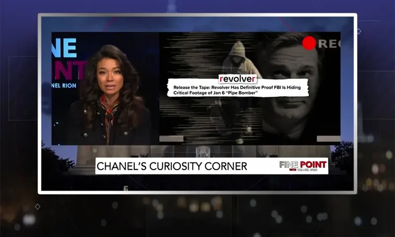 Video still of the host of Fine Point at the desk of their talk show on One America News Network.