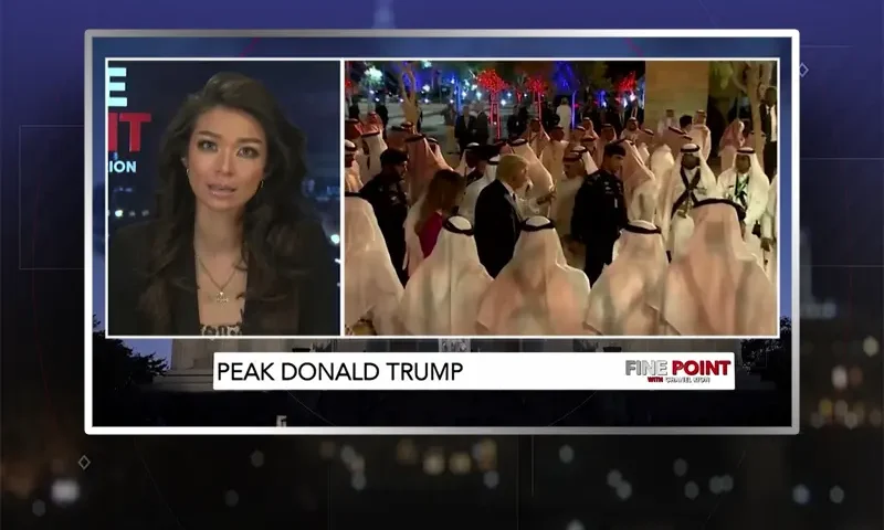 Video still of the host of Fine Point at the desk of their talk show on One America News Network.