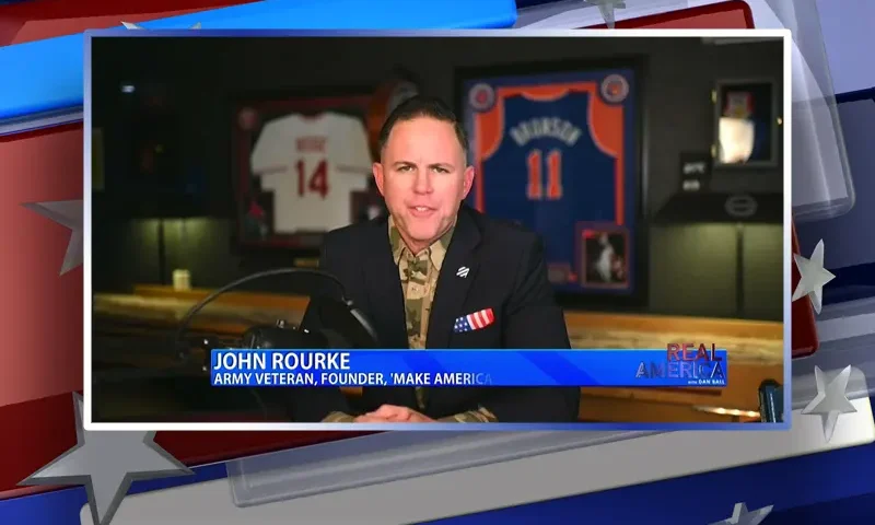 Video still from Real America on One America News Network during an interview with the guest, John Rourke.
