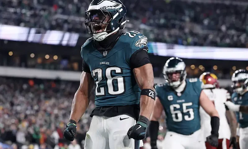Philadelphia Eagles running back Saquon Barkley (26) celebrates after a touchdown against the Washington Commanders during the second half in the NFC Championship game at Lincoln Financial Field. Mandatory Credit: Bill Streicher-Imagn Images