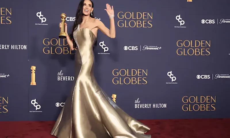Demi Moore poses with the award for Best Performance by an Actress in a Motion Picture - Musical or Comedy, for The Substance, at the 82nd Golden Globe Awards in Beverly Hills, California, U.S., January 5, 2025. REUTERS/Mario Anzuoni/File photo