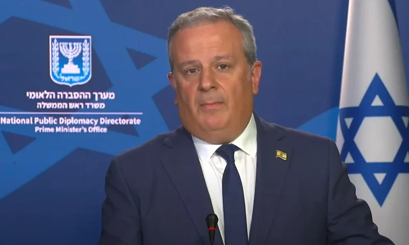 Israeli Government Spokesman for the National Public Diplomacy Directorate in the Office of the Prime Minister, David Mencer. (Photo via: screenshot from daily briefing - IDF)