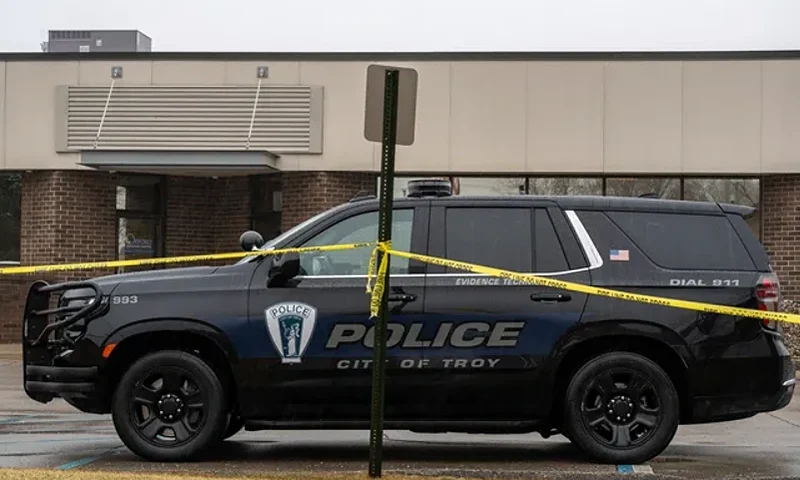 Troy Police Department vehicle parked outside of the center. (Photo via: Troy Police Department / David Rodriguez Munoz of the Detroit Free Press outlet)