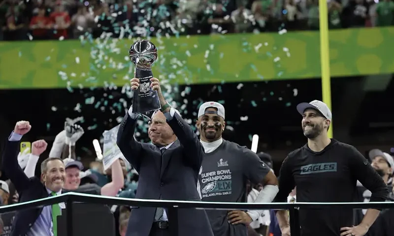 Philadelphia Eagles owner Jeffrey Lurie, Jalen Hurts and head coach Nick Sirianni celebrate with the Vince Lombardi Trophy after winning Super Bowl LIX REUTERS/Mike Segar