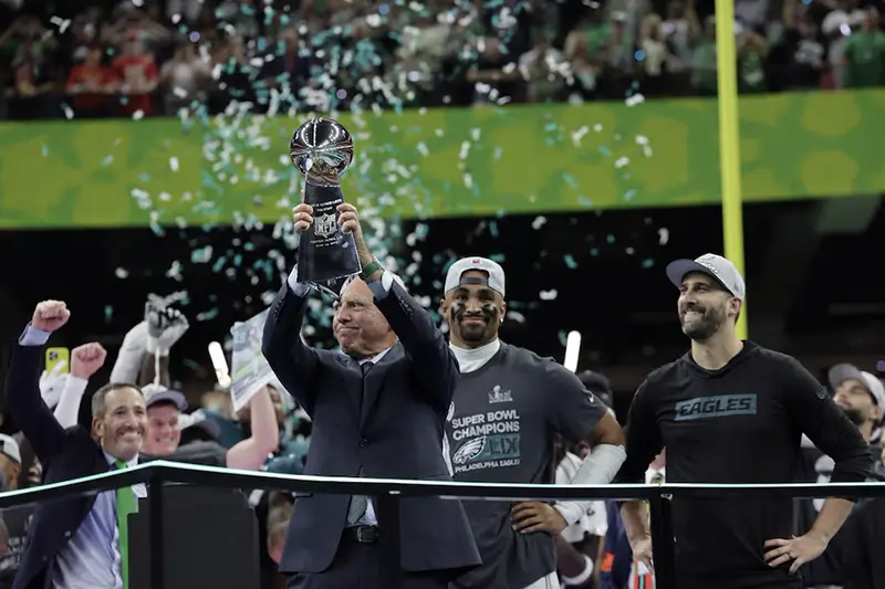 Philadelphia Eagles owner Jeffrey Lurie, Jalen Hurts and head coach Nick Sirianni celebrate with the Vince Lombardi Trophy after winning Super Bowl LIX REUTERS/Mike Segar