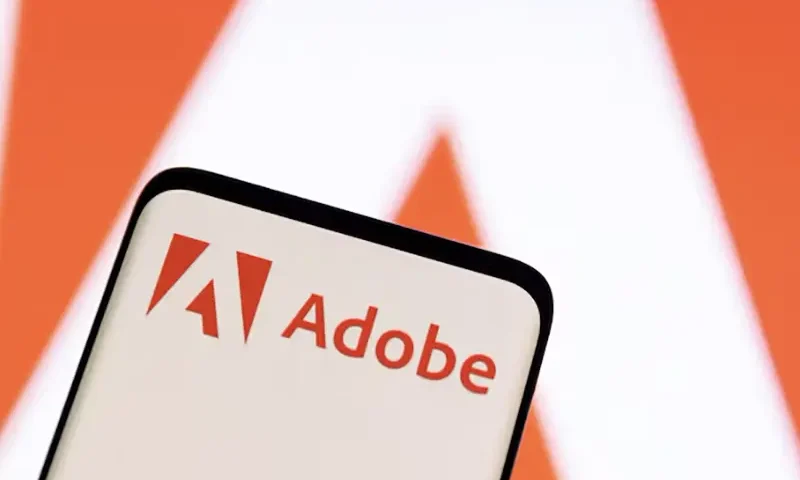 Adobe logo is seen on smartphone in this illustration taken June 13, 2022. REUTERS/Dado Ruvic/Illustration//File Photo