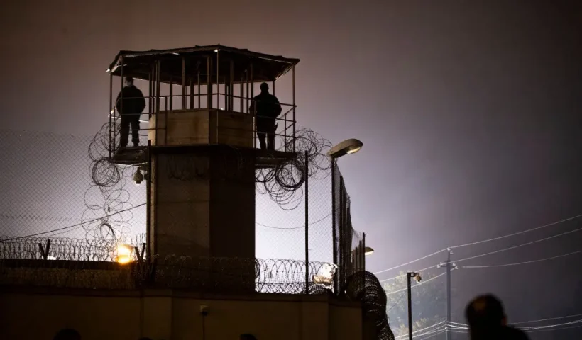 TBILISI, GEORGIA - NOVEMBER 06: Prison guards stand guard in the watchtower during a rally organized by the National Movement in front of #12 penitentiary facility demanding transfer of Mikheil Saakashvili to a civilian hospital on November 6, 2021 in Tbilisi, Georgia. Georgia's third president, Mikhail Saakashvili, has been on hunger strike since October 1, the day the former head of state was imprisoned upon returning to his country after nine years in exile. (Photo by Daro Sulakauri/Getty Images)