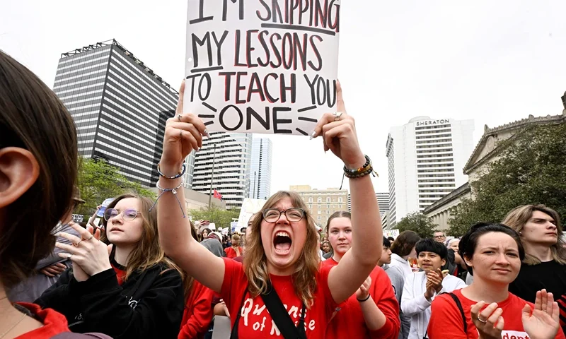 TOPSHOT - Anti-gun demonstrators protest at the Tennessee Capitol for stricter gun laws in Nashville, Tennessee, on April 3, 2023. - Students were encouraged by an anti-gun violence group to walk out of classrooms at 10:13 AM, the same time police say a transgender person entered The Covenant School beginning an attack in which three young children and three adults were killed last week at a private Christian school in Nashville. (Photo by John Amis / AFP) (Photo by JOHN AMIS/AFP via Getty Images)