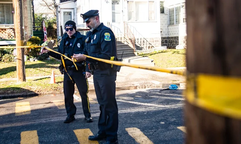 EAST LANSDOWNE, PENNSYLVANIA - FEBRUARY 8: Police tape off the area around a home that was set ablaze and where at least six people remain unaccounted for on February 8, 2024 in East Lansdowne, Pennsylvania. On Wednesday police responded to a report that a child had been shot in the home, upon arrival two police officers were shot and a gunfight ensued. Delaware County District Attorney Jack Stollsteimer says at some point, the home was set on fire as police surrounded the home. (Photo by Matthew Hatcher/Getty Images)