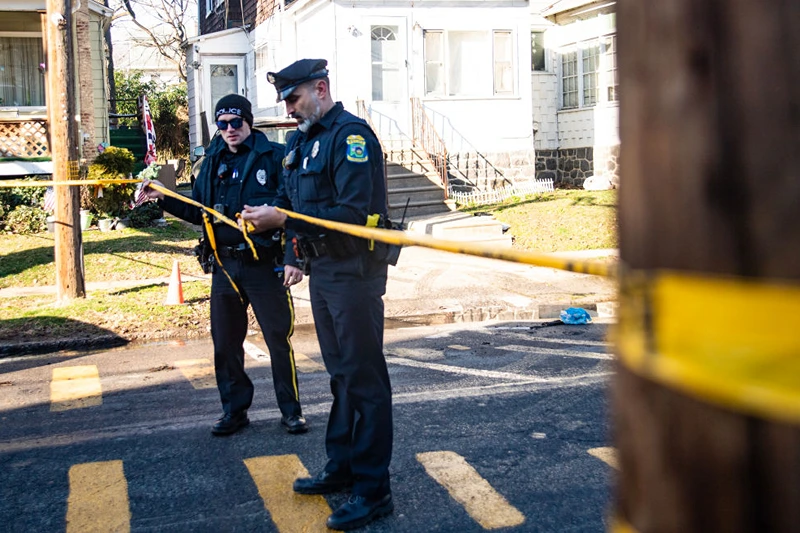 EAST LANSDOWNE, PENNSYLVANIA - FEBRUARY 8: Police tape off the area around a home that was set ablaze and where at least six people remain unaccounted for on February 8, 2024 in East Lansdowne, Pennsylvania. On Wednesday police responded to a report that a child had been shot in the home, upon arrival two police officers were shot and a gunfight ensued. Delaware County District Attorney Jack Stollsteimer says at some point, the home was set on fire as police surrounded the home. (Photo by Matthew Hatcher/Getty Images)