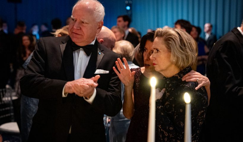 WASHINGTON, DC - NOVEMBER 22: U.S. Commerce Secretary Gina Raimondo (C) speaks with former Democratic vice presidential nominee, Minnesota Gov. Tim Walz (L) and his wife, Minnesota first lady Gwen Walz (R), during a dinner on the South Lawn of the White House on November 22, 2024 in Washington, DC. U.S. President Joe Biden and first lady Jill Biden are hosting a dinner to thank longtime supporters. (Photo by Andrew Harnik/Getty Images)