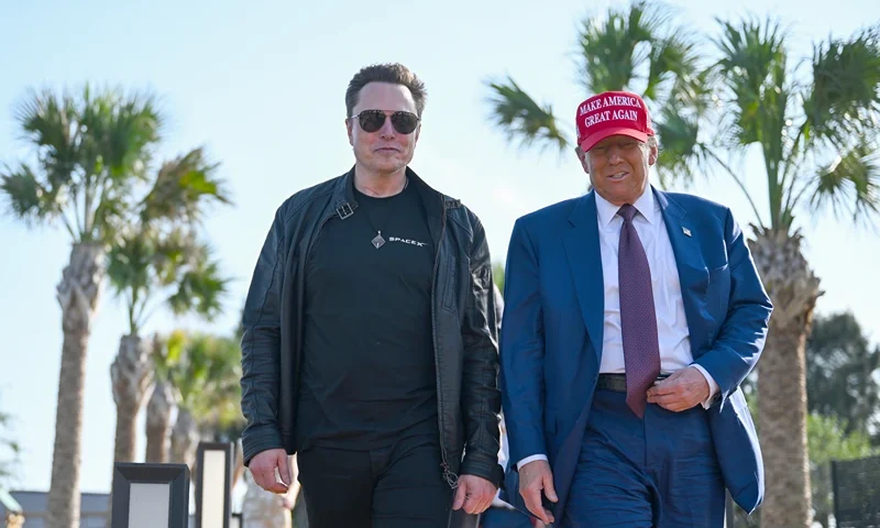 BROWNSVILLE, TEXAS - NOVEMBER 19: U.S. President-elect Donald Trump greets Elon Musk as he arrives to attend a viewing of the launch of the sixth test flight of the SpaceX Starship rocket on November 19, 2024 in Brownsville, Texas. SpaceX’s billionaire owner, Elon Musk, a Trump confidante, has been tapped to lead the new Department of Government Efficiency alongside former presidential candidate Vivek Ramaswamy. (Photo by Brandon Bell/Getty Images)