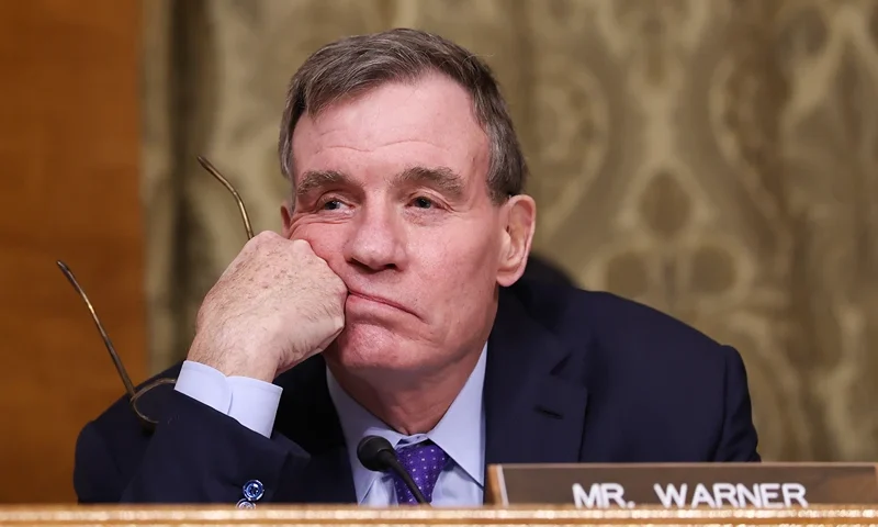 WASHINGTON, DC - JANUARY 22: Sen. Mark Warner (D-VA) listens to the testimony of U.S. President Donald Trump's nominee for Office of Management and Budget Director Russell Vought during his Senate Banking Committee nomination hearing in the Dirksen Senate Building on January 22, 2025 in Washington, DC. Vought's confirmation hearing was on January 15. If elected he plans to implement a plan to reduce both the size of the federal government and federal spending. (Photo by Kayla Bartkowski/Getty Images)