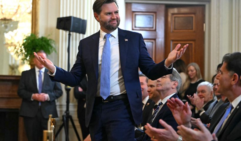 US Vice President JD Vance gestures after unseen US President Donald Trump asked him to stand up during a press conference with unseen Israel's Prime Minister Benjamin Netanyahu in the East Room of the White House in Washington, DC, on February 4, 2025. (Photo by ANDREW CABALLERO-REYNOLDS / AFP) (Photo by ANDREW CABALLERO-REYNOLDS/AFP via Getty Images)
