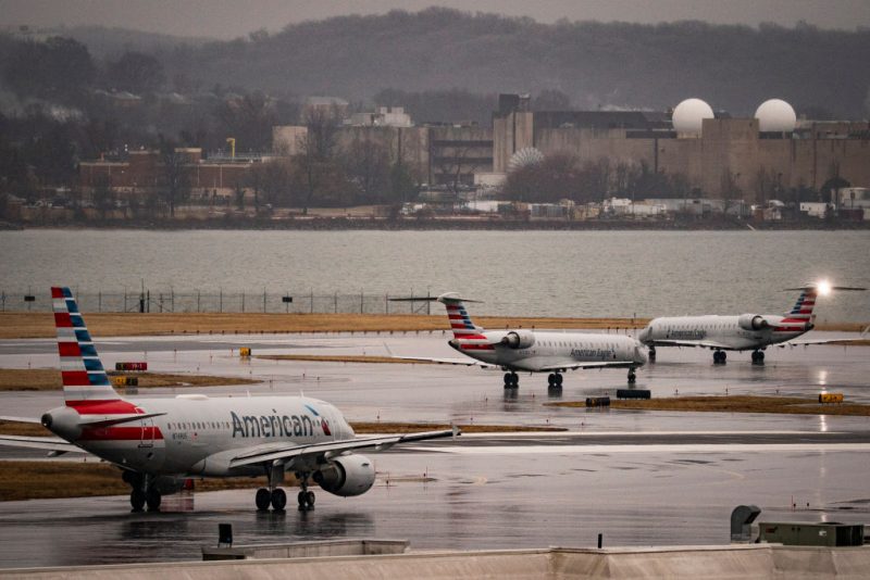 ARLINGTON, VIRGINIA - FEBRUARY 6: American Eagle and American Airlines planes taxi on the runway at Ronald Reagan National Airport, on February 6, 2025 in Arlington, Virginia. An American Airlines flight from Wichita, Kansas collided midair with a military Black Hawk helicopter while on approach to Ronald Reagan Washington National Airport on January 29, 2025 outside of Washington, DC.(Photo by Al Drago/Getty Images)