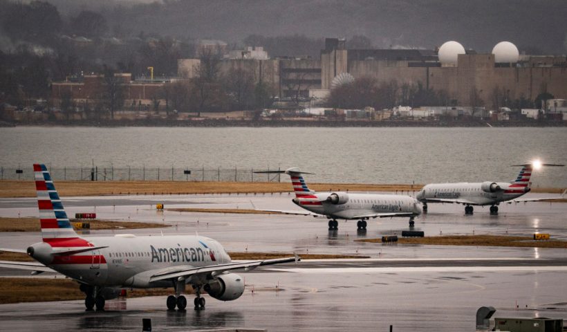 ARLINGTON, VIRGINIA - FEBRUARY 6: American Eagle and American Airlines planes taxi on the runway at Ronald Reagan National Airport, on February 6, 2025 in Arlington, Virginia. An American Airlines flight from Wichita, Kansas collided midair with a military Black Hawk helicopter while on approach to Ronald Reagan Washington National Airport on January 29, 2025 outside of Washington, DC.(Photo by Al Drago/Getty Images)
