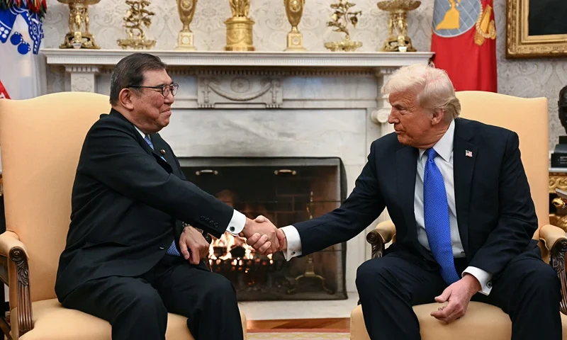 TOPSHOT - US President Donald Trump shakes hands with with Japanese Prime Minister Shigeru Ishiba in the Oval Office of the White House in Washington, DC, on February 7, 2025. (Photo by Jim WATSON / AFP) (Photo by JIM WATSON/AFP via Getty Images)