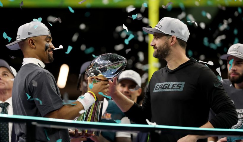 NEW ORLEANS, LOUISIANA - FEBRUARY 09: Jalen Hurts #1 of the Philadelphia Eagles hands the Vince Lombardi Trophy to head coach Nick Sirianni after beating the Kansas City Chiefs 40-22 to win Super Bowl LIX at Caesars Superdome on February 09, 2025 in New Orleans, Louisiana. (Photo by Jamie Squire/Getty Images)