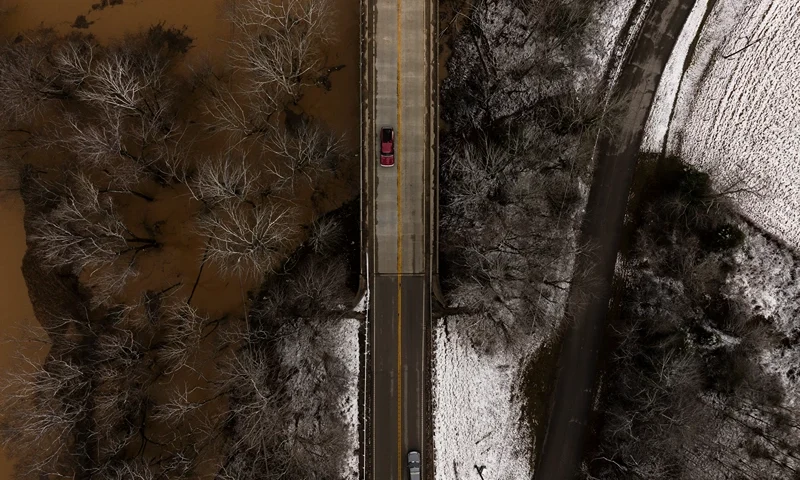 In this aerial view, the Barren River floods around Kentucky Route 185 on February 16, 2025 in Bowling Green, Kentucky. Severe winter storms brought torrential rains causing intense flooding in Kentucky and parts of Florida and Georgia. (Photo by Brett Carlsen/Getty Images)