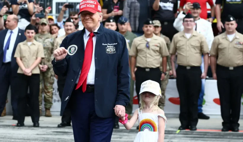 US President Donald Trump stands on the grid during pre-race ceremonies prior to the NASCAR Cup Series Daytona 500 at Daytona International Speedway on February 16, 2025 in Daytona Beach, Florida. (Photo by Chris Graythen / POOL / AFP) (Photo by CHRIS GRAYTHEN/POOL/AFP via Getty Images)