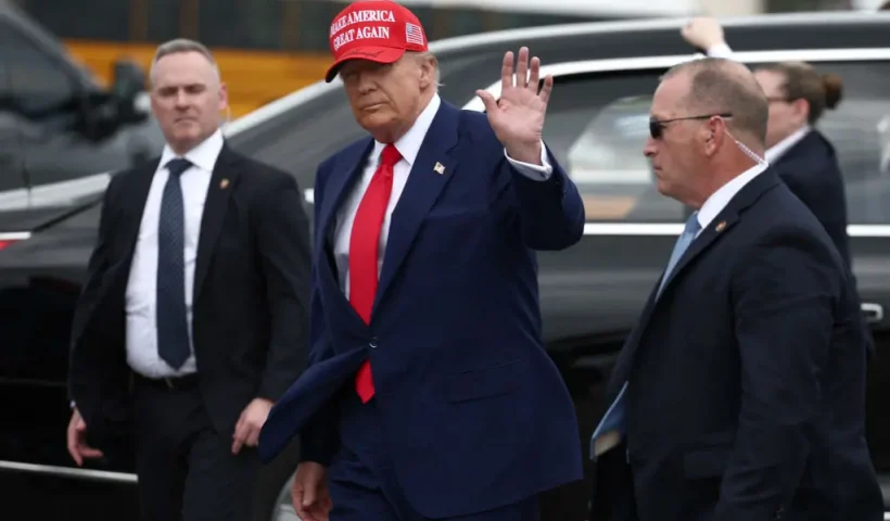 US President Donald Trump waves to NASCAR fans on the grid prior to the NASCAR Cup Series Daytona 500 at Daytona International Speedway on February 16, 2025 in Daytona Beach, Florida. (Photo by Chris Graythen / POOL / AFP) (Photo by CHRIS GRAYTHEN/POOL/AFP via Getty Images)