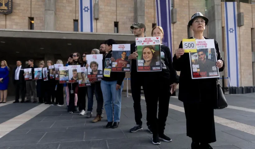 JERUSALEM - FEBRUARY 17: Families of hostages held in the Gaza Strip and supporters hold 73 posters of hostages at the entrance to the Israeli parliament as they demand the Israeli government to continue the next phase of the hostages deal with Hamas on February 17, 2025 in Jerusalem. Families and supporters of hostages being held by Hamas in Gaza are marking 500 days since their capture on October 7, 2023. In commemoration of the somber milestone, campaigners announced a 500 minute fast, to be followed by demonstrations calling for the release of the remaining hostages. (Photo by Amir Levy/Getty Images)